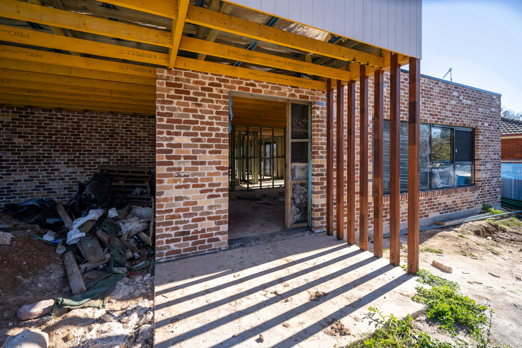 Open timber frame inside a Western Sydney build before the walls are lined